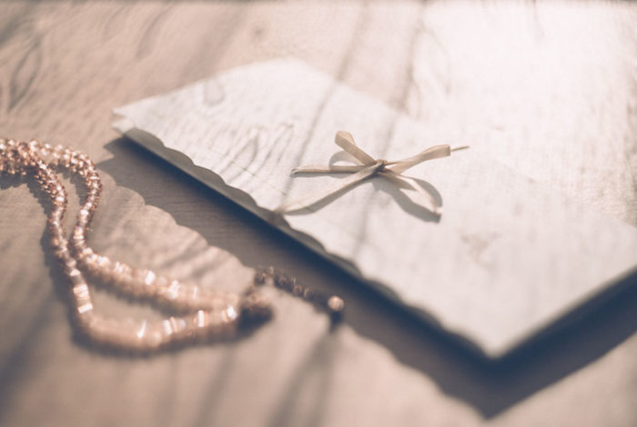 An envelope full of memories, symbolizing shared healing and grief support.