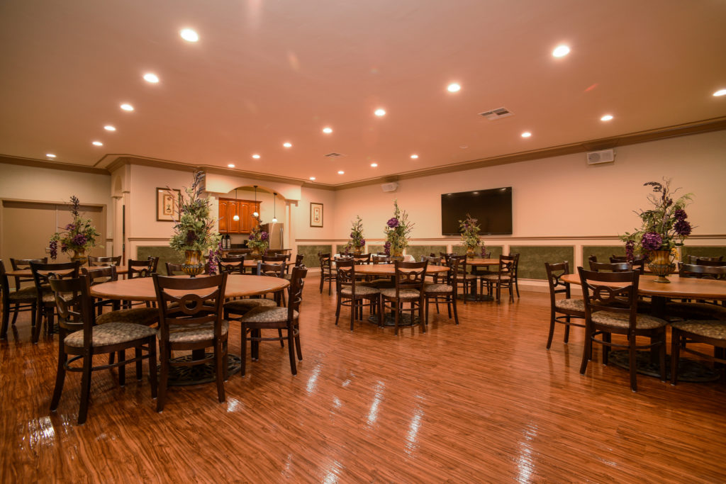 A reception hall set up for a memorial event, offering a warm and supportive space.